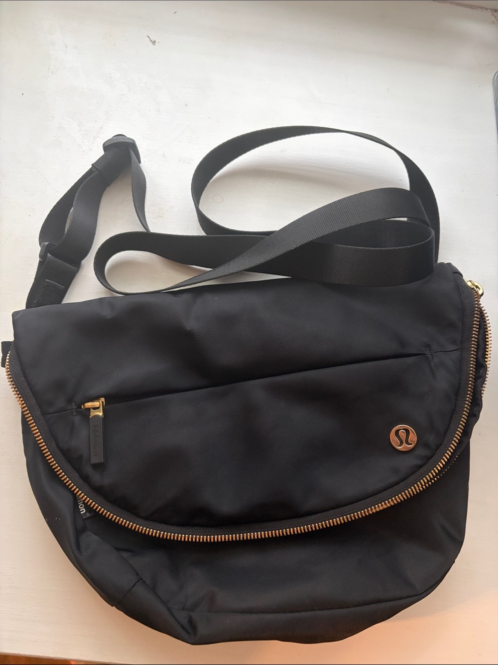 lululemon athletica Black Messenger Bag with Gold Accents